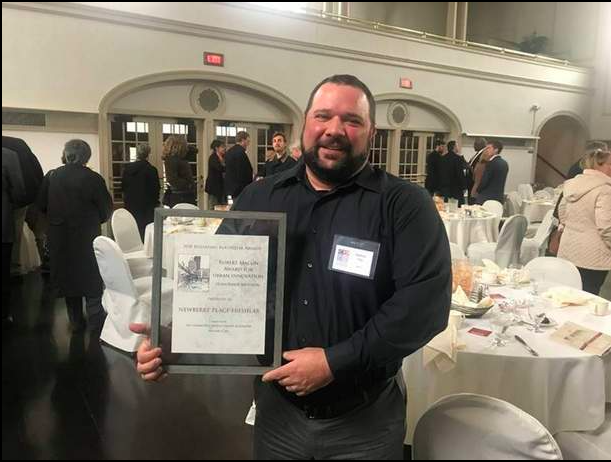 Matt Gray. co-owner of Batavia Brewing Co/Eli Fish, accepted the Robert Macon Award from the Community Design Center of Rochester on behalf of the Newberry Project